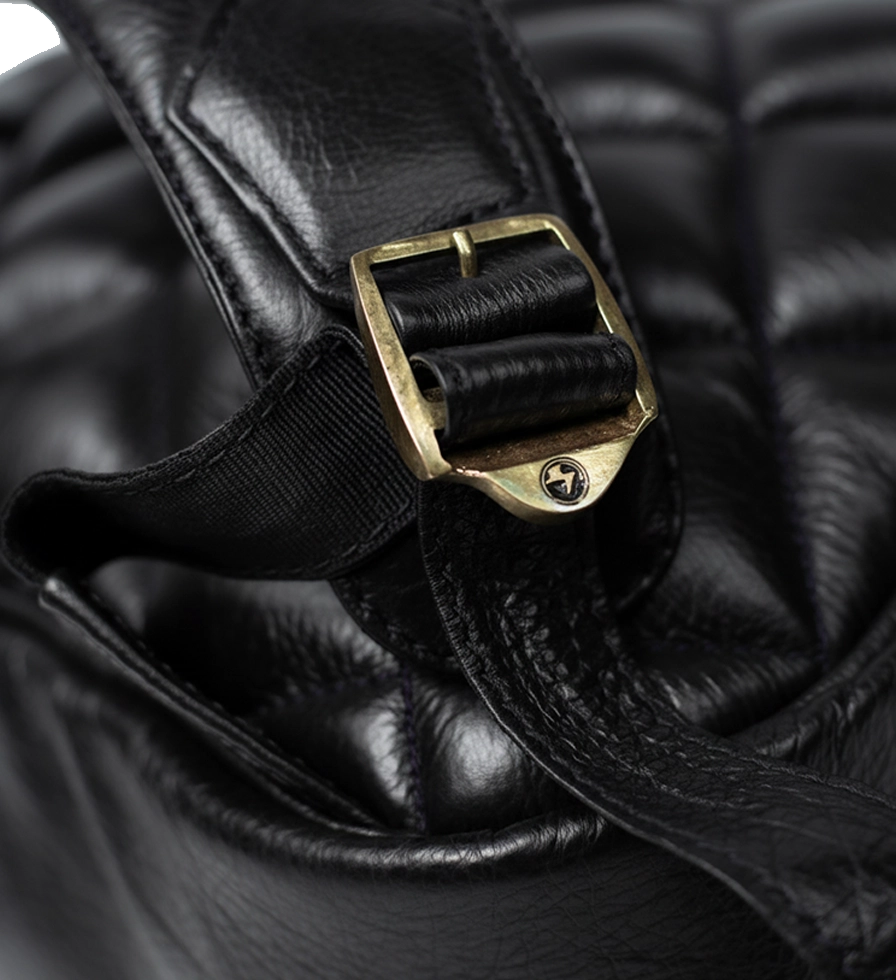 Buckle Close Up view of CHARGEO Park Town Backpack in Charcoal leather. Buckle Close Up view of CHARGEO Park Town Backpack in Charcoal leather.