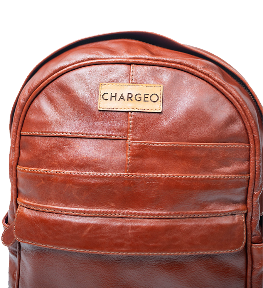 Front Close up view of CHARGEO Sandton Backpack in Cognac leather. Front Close up view of CHARGEO Sandton Backpack in Cognac leather.