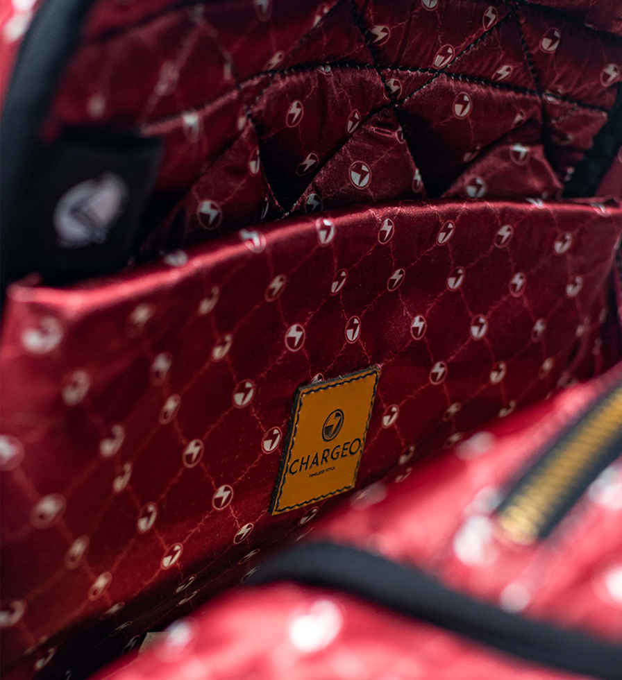 CHARGEO Leather Westville Backpack Ruby Red open view close up. CHARGEO Leather Westville Backpack Ruby Red open view close up.