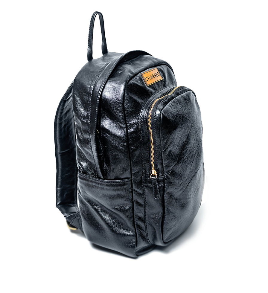 Diagonal view of CHARGEO Park Town Backpack in Charcoal leather. Diagonal view of CHARGEO Park Town Backpack in Charcoal leather.