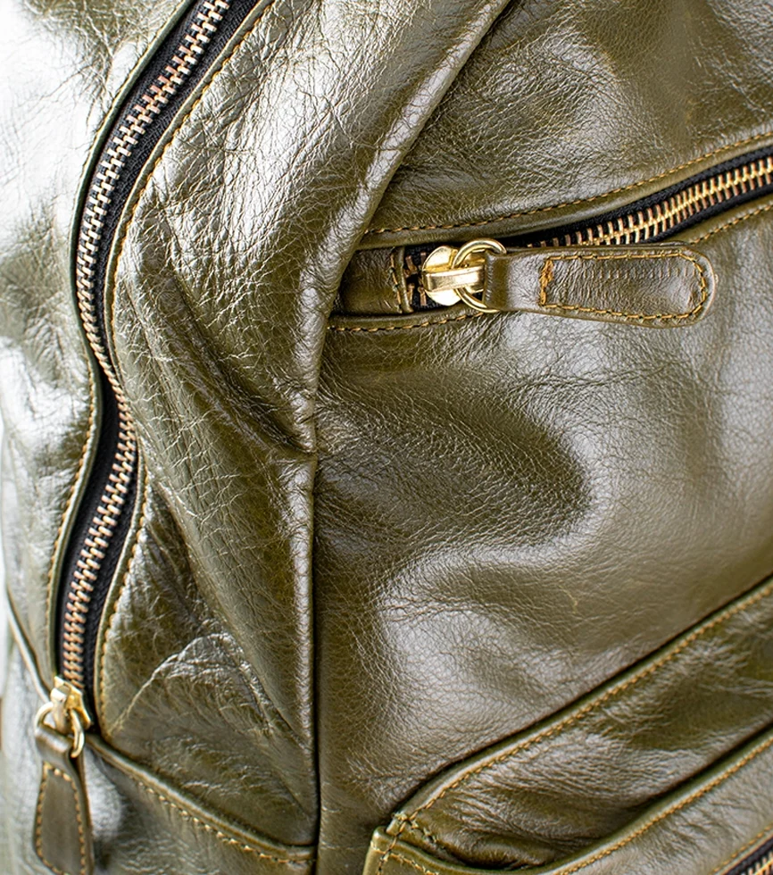 Close Up Diagonal Top side view of the CHARGEO Morningside Avocado leather backpack