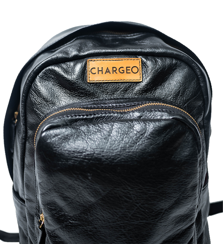 Close Up view of CHARGEO Park Town Backpack in Charcoal leather. Close Up view of CHARGEO Park Town Backpack in Charcoal leather.