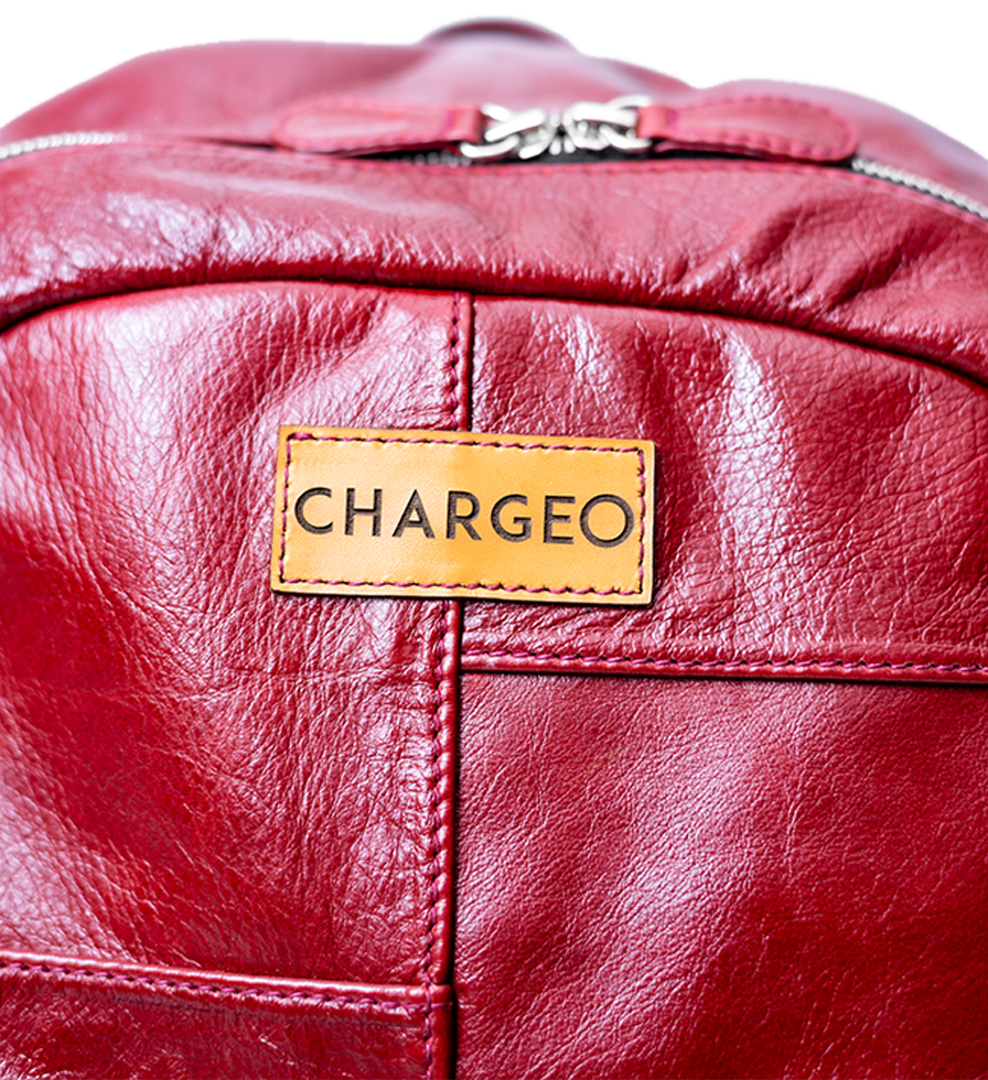 CHARGEO Leather Westville Backpack Ruby Red front view close up. CHARGEO Leather Westville Backpack Ruby Red front view close up.
