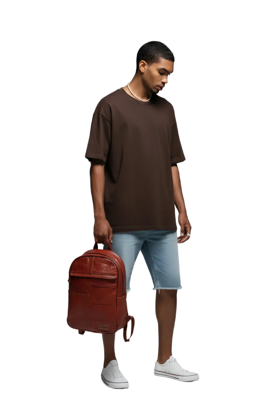 Model hanging the Chargeo Stellenbosch Cognac bag with one hand on the side