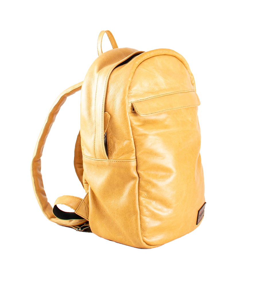 Diagonal view of CHARGEO Waterfall Backpack in Butter Tan leather