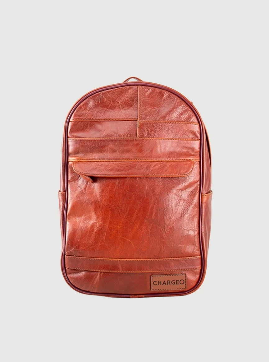 Front view of cognac leather CHARGEO Sandton Backpack with front pocket