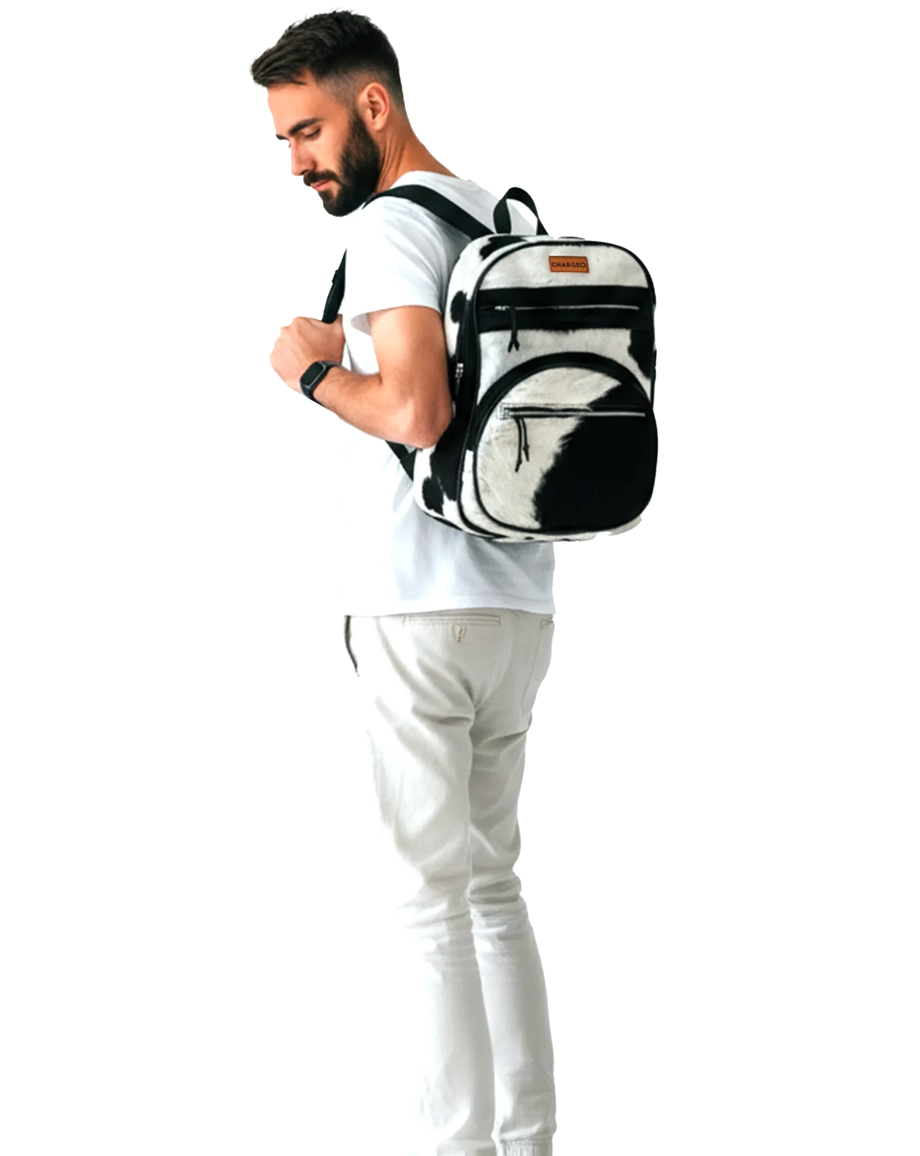 Man wearing a CHARGEO Zulu Treasure Backpack in cowhide leather over his shoulder, looking down