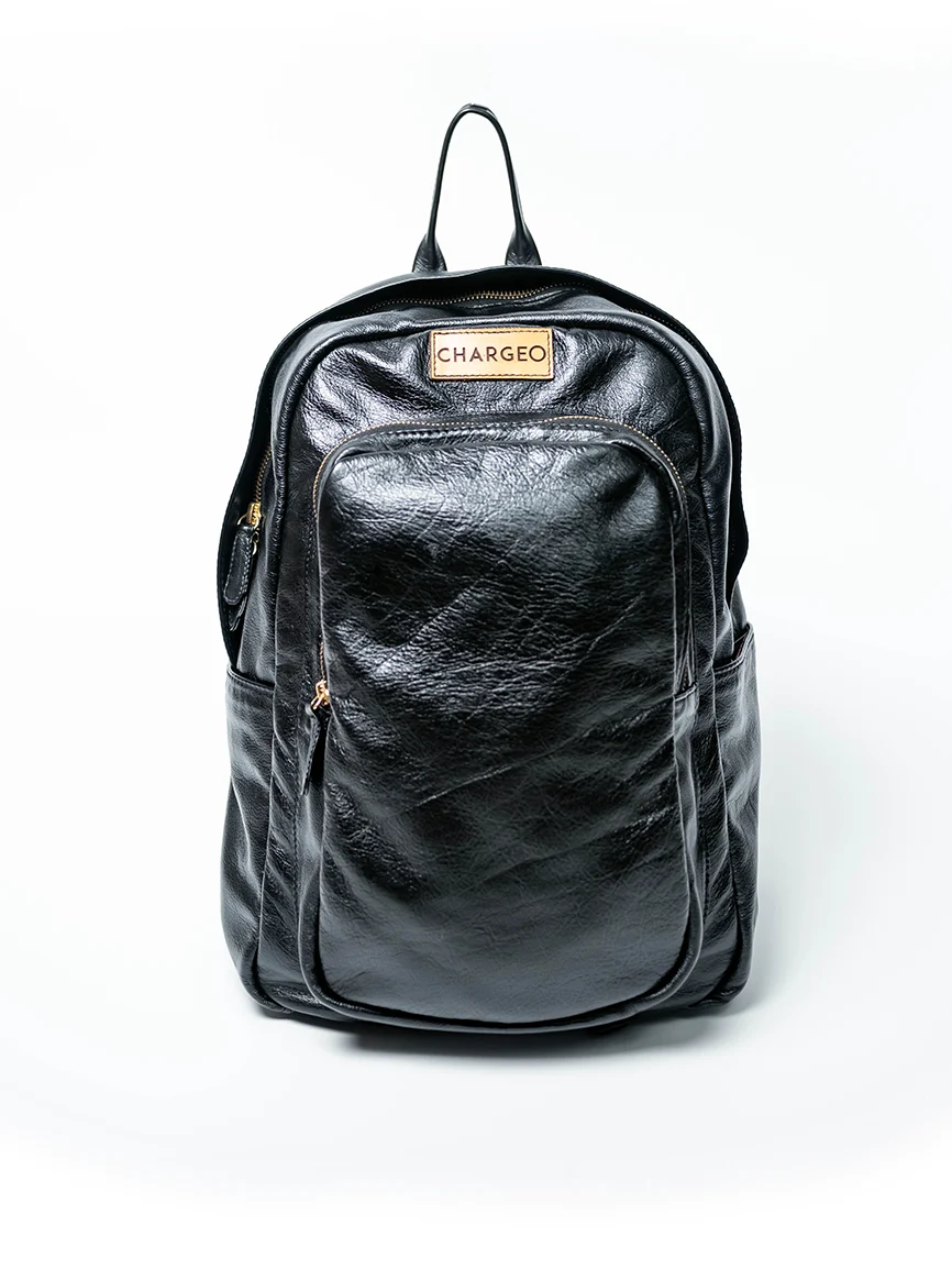 Front view of CHARGEO Park Town Backpack in Charcoal leather.