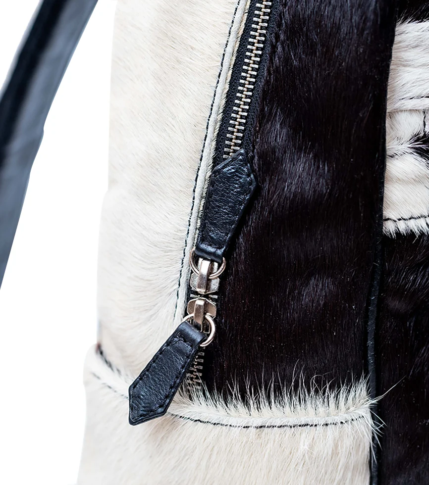 Zipper Close Up view of the CHARGEO Zulu Treasure Backpack in cowhide