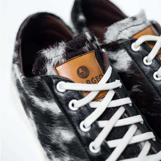 CHARGEO Zulu Treasure leather sneakers, close-up detail of Nguni cowhide texture and laces