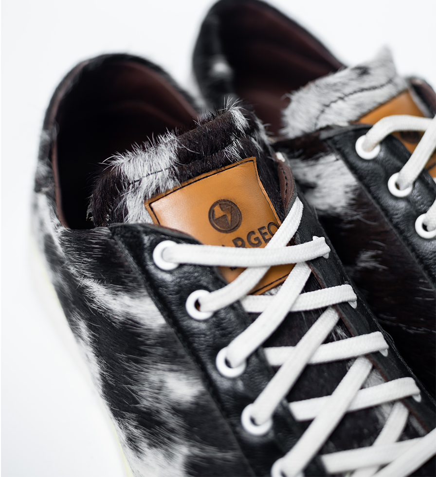 CHARGEO Zulu Treasure leather sneakers, close-up detail of Nguni cowhide texture and laces