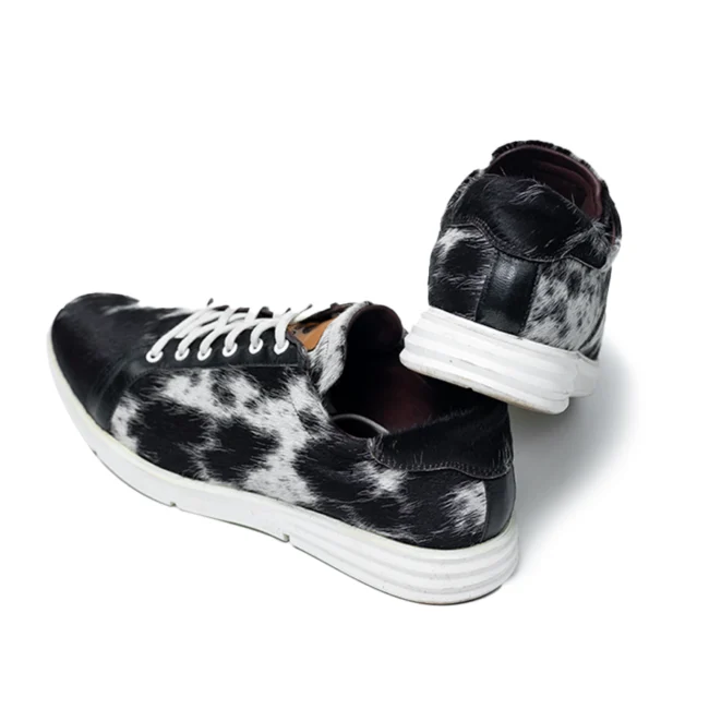 CHARGEO Zulu Treasure leather sneakers in black and white Nguni cowhide, side profile pair