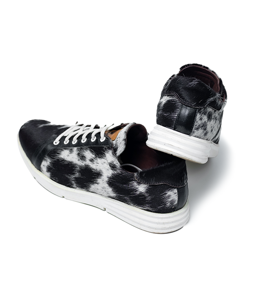 CHARGEO Zulu Treasure leather sneakers in black and white Nguni cowhide, side profile pair