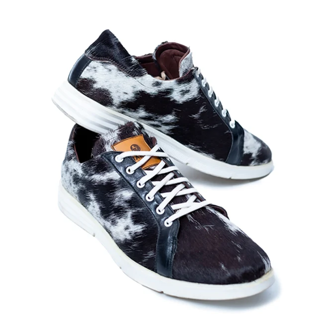 CHARGEO Zulu Treasure leather sneakers in black and white Nguni cowhide, three-quarter side view