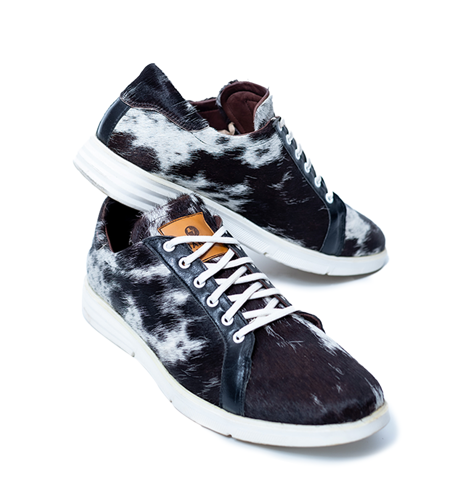 CHARGEO Zulu Treasure leather sneakers in black and white Nguni cowhide, three-quarter side view
