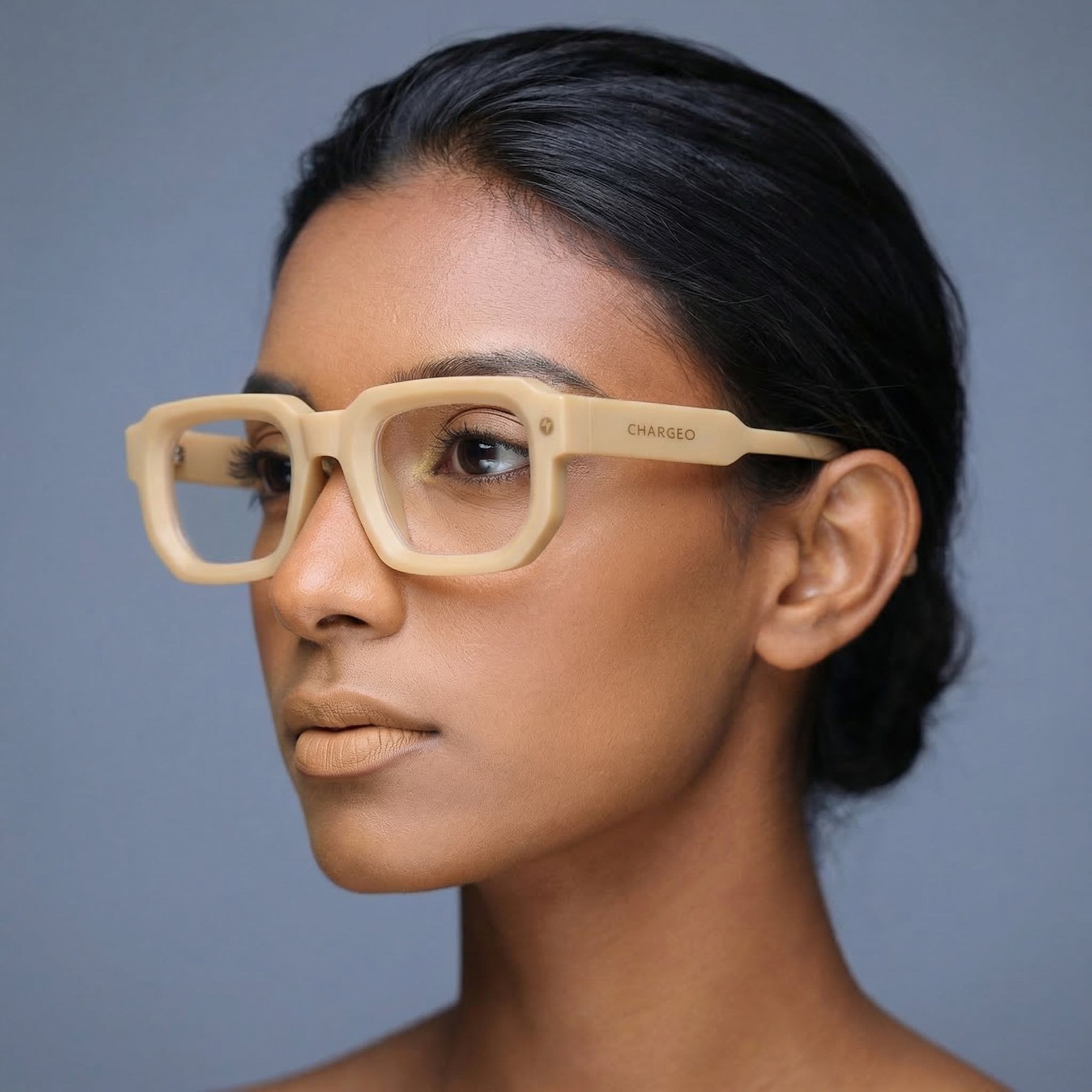 Woman wearing CHARGEO glasses with a square frame in Butter Tan