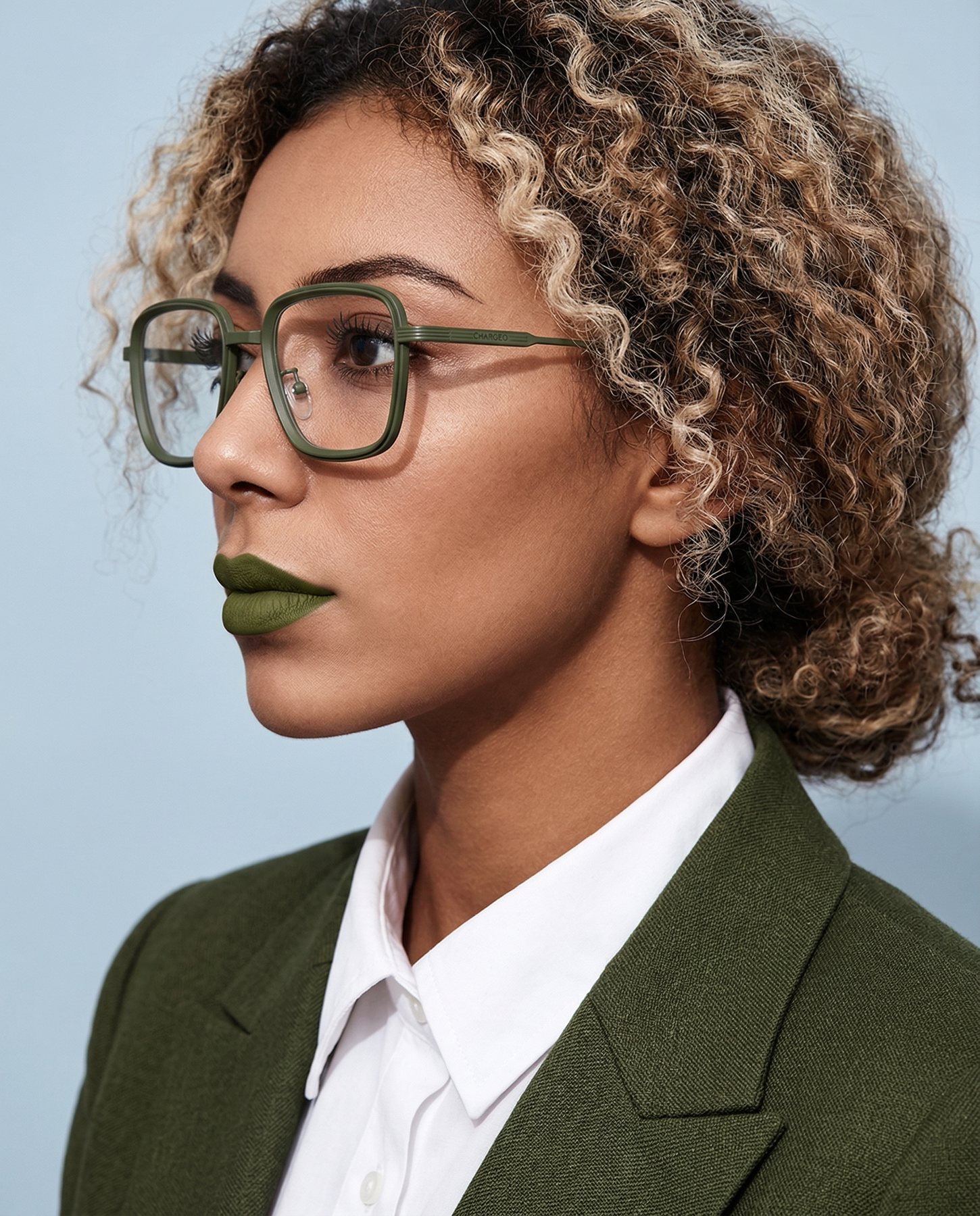 Woman wearing CHARGEO glasses with a slim frame in Avocado