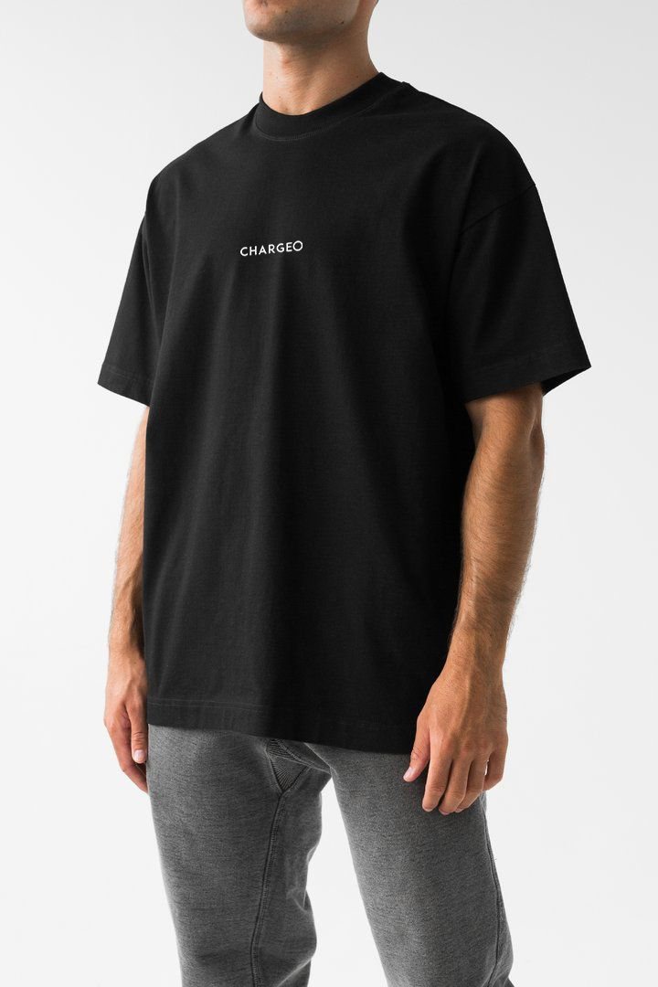 A man in the black CHARGEO T-shirt