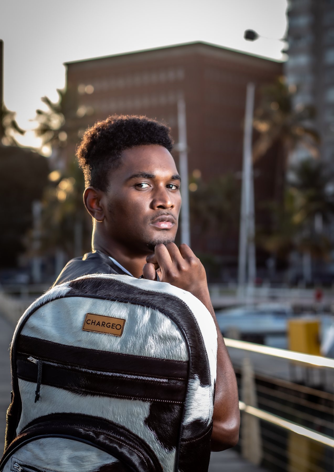A man with a CHARGEO Zulu Treasure backpack, 2023